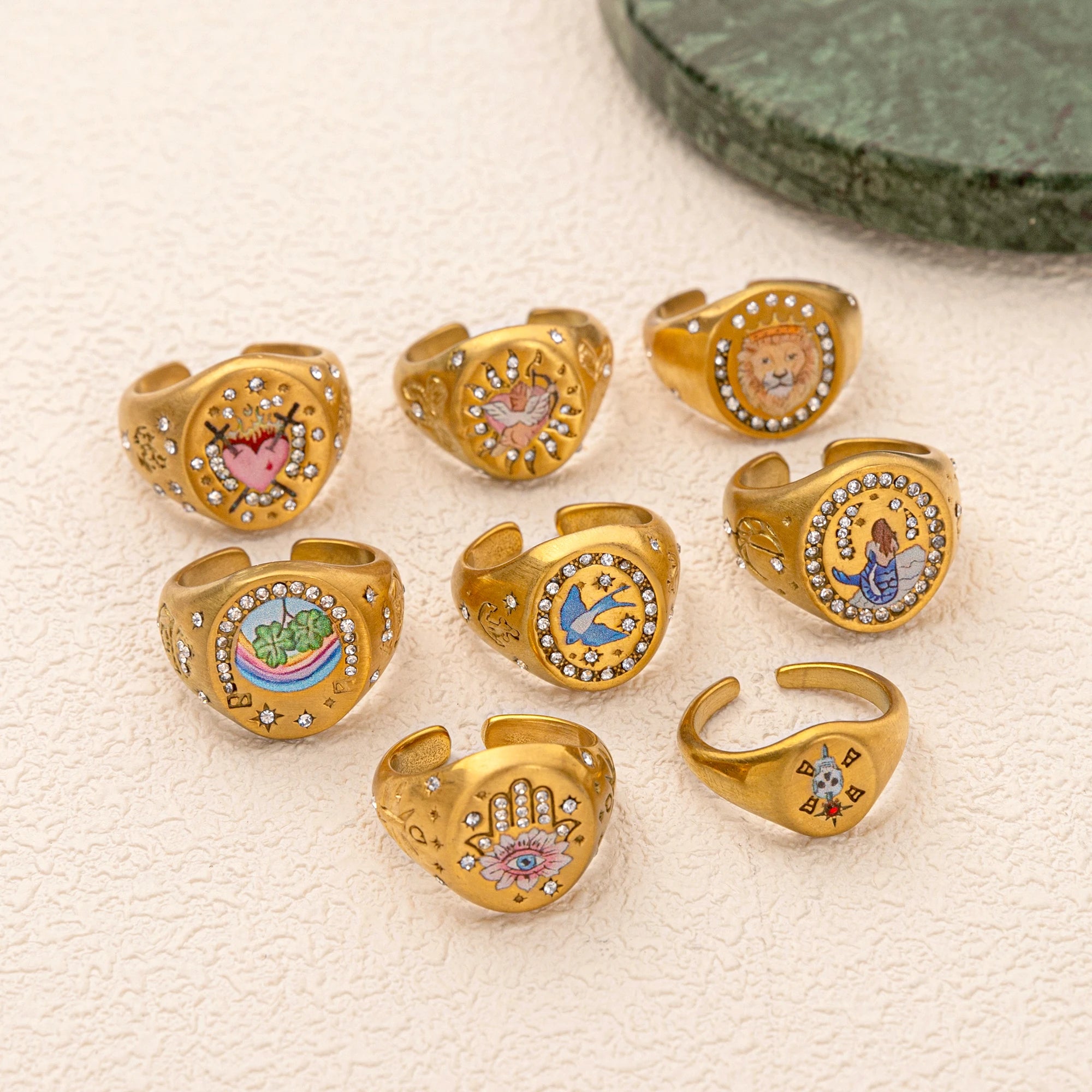Emblem of Strength Gold‑Plated Art Ring – Lion, Mermaid, Doves, Cupid, Skull & Evil Eye Design
